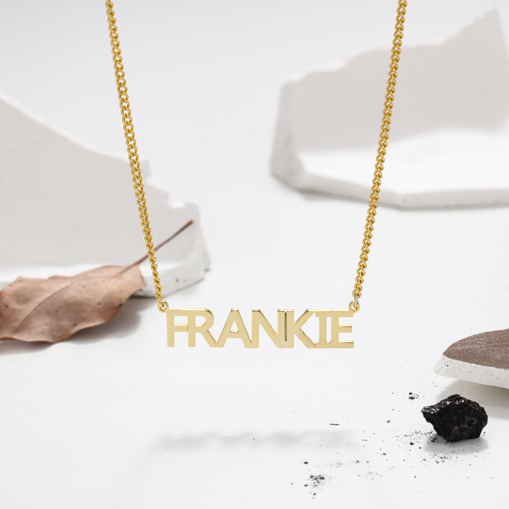 block caps name necklace gold