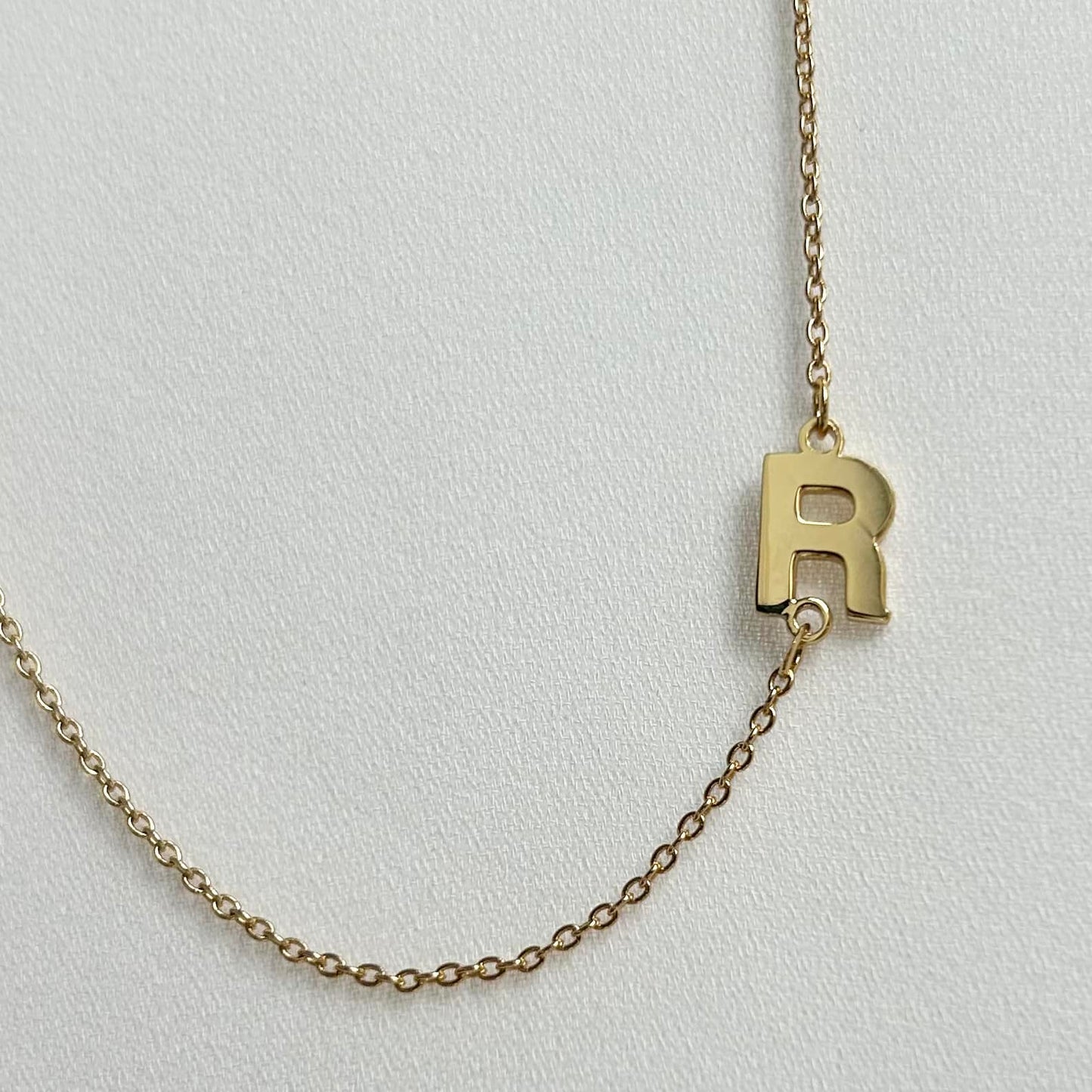 gold sideways initial necklace